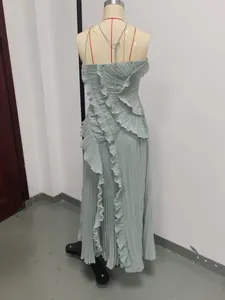 Detail back view of a sage green pleated strapless maxi dress displayed on a mannequin