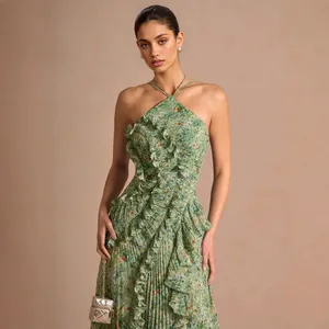 Elegant green floral pleated evening dress with ruffle details and halter neck