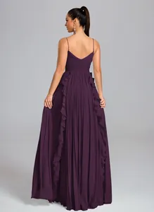 Detailed back view of a pleated plum formal dress with spaghetti straps and ruffles.