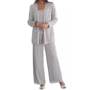 Detail view of elegant silver lace cardigan and flowing grey chiffon wide-leg trousers set