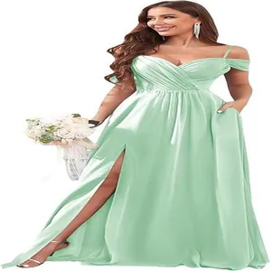 Detailed view of mint green off-the-shoulder pleated bridesmaid dress with high slit