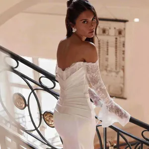 Back view of elegant off-the-shoulder lace mermaid wedding dress with small train