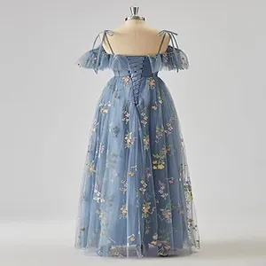 Detailed back view of a light blue evening gown featuring floral embroidery and a lace-up corset