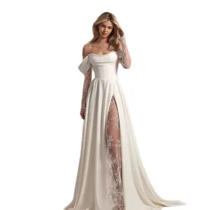 Elegant off-the-shoulder wedding dress with lace sleeves and high slit detail.