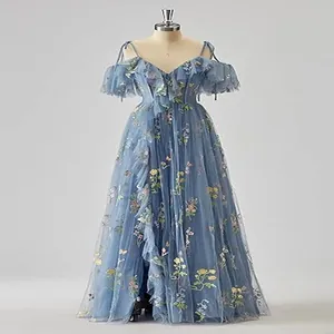 Detailed view of a blue evening gown featuring elegant floral embroidery and ruffle sleeves