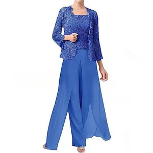 Elegante completo donna con giacca in pizzo blu reale e pantaloni larghi in chiffon