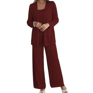 Detail view of burgundy lace cardigan and chiffon pants for elegant formal wear