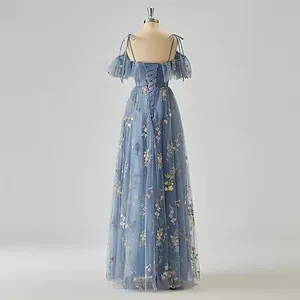 Elegant misty blue floor-length evening gown with colorful floral embroidery and straps