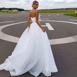 Elegant French style strapless white tulle wedding dress for grand outdoor reception