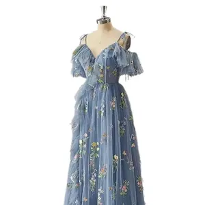 Elegant blue off-the-shoulder evening gown with floral embroidery and tulle ruffles
