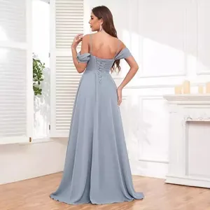 Detailed back view showing the elegant lace-up design of a dusty blue bridesmaid gown.