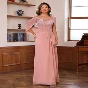 Detailed view of elegant pink lace and chiffon evening gown with split cape sleeves.