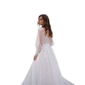 Elegant lace V-neck wedding dress with long sheer sleeves and slim-fit silhouette