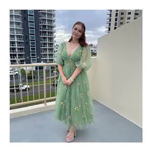 Elegant sage green V-neck mesh evening gown with colorful floral embroidery and puff sleeves