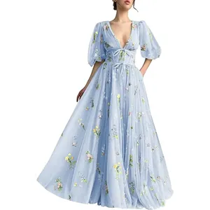 Detail showing the elegant light blue floral v-neck prom dress with puff sleeves.