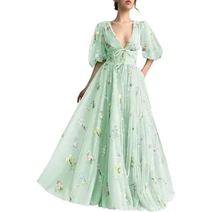 Elegant light green V-neck evening gown with floral embroidery and puff sleeves.