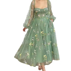 Elegant sage green mesh prom dress with intricate floral embroidery and lantern sleeves