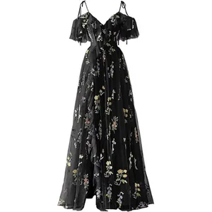 Elegant black V-neck evening gown featuring vibrant floral embroidery and cold-shoulder ruffles