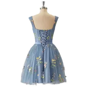 Elegant light blue short formal dress with floral embroidery and corset back detail.