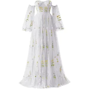 Elegant long tulle ball gown with yellow floral embroidery and sheer puff sleeves detail