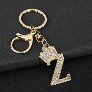 Detailed view of gold tone letter Z keychain with sparkly rhinestone crown ornament