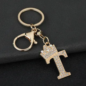 Detailed view of elegant gold letter T keychain with sparkly rhinestones and crown