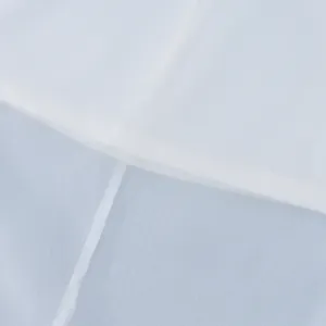 Close-up of lightweight see-through fabric showing seam detail on a white skirt