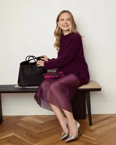 Elegant sheer high-waisted purple midi skirt styled with a matching sweater