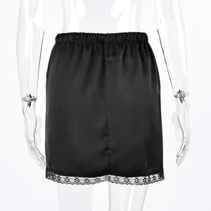 Detailed back view of a black satin mini skirt featuring elegant lace trim at the bottom hem