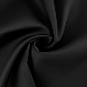Macro view of luxurious black satin fabric with subtle sheen and fine twill texture