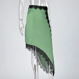 Elegant green asymmetrical satin midi skirt featuring delicate black lace trim details