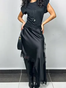 Elegant asymmetrical black satin midi skirt featuring delicate lace trim and silky finish
