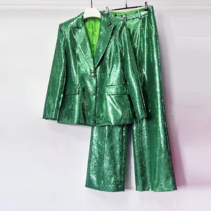 Elegant emerald green sequin suit set with slim-fit blazer and wide-leg trousers.