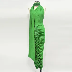 Detail view of the green rhinestone halter top and ruched knit skirt two-piece set
