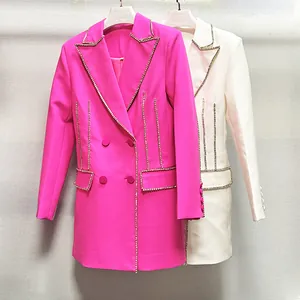 Detail of rhinestone-trimmed double-breasted blazer dresses in fuchsia and white.