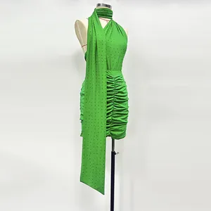 Close-up detailed view of a green rhinestone knitted two-piece set displayed on a mannequin