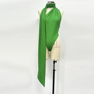 Detail view of green hot-drilled knitted bodysuit with long neck sash embellishment