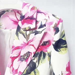 Macro view of high-quality pink floral print on white slim-fit suit jacket collar