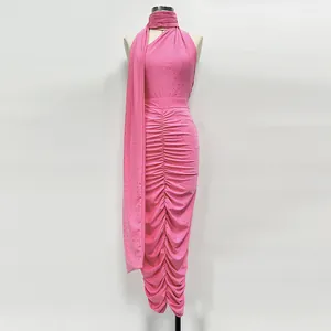 Detailed view of elegant pink rhinestone halter top and ruched midi skirt two-piece knit set