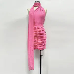 Elegant pink rhinestone two-piece set featuring a halter neck top and ruched mini skirt