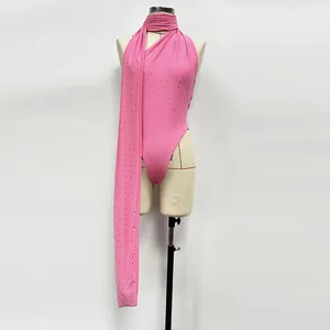 Detailed macro view of an elegant pink stretch knit bodysuit with rhinestones on a mannequin