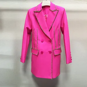 Detail of fuchsia blazer dress featuring luxurious rhinestone and bead embellishments.