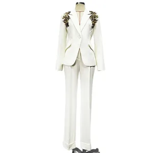 Elegant white suit set with heavy beadwork blazer and slim-fit trousers