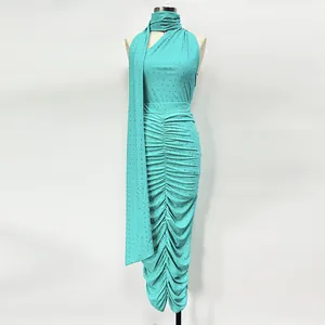 Detailed view of turquoise rhinestone ruched top and matching skirt set on mannequin