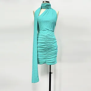 Detailed view of the teal sparkling rhinestone knit top and ruched mini skirt set