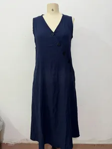 Navy blue sleeveless V-neck linen maxi dress with side button detail on mannequin