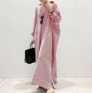 Full length view of a oversized red and white striped shirt dress for women