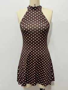 Front view of brown polka dot halter dress on mannequin showing detailed pattern and cut.