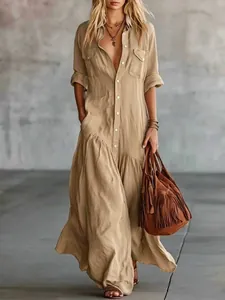 Elegant khaki long button-down shirt dress featuring a tiered skirt, pockets and boho style