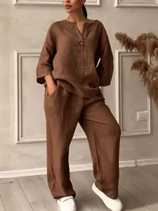 Full view of women's brown linen-style two-piece set with relaxed top and wide-leg trousers